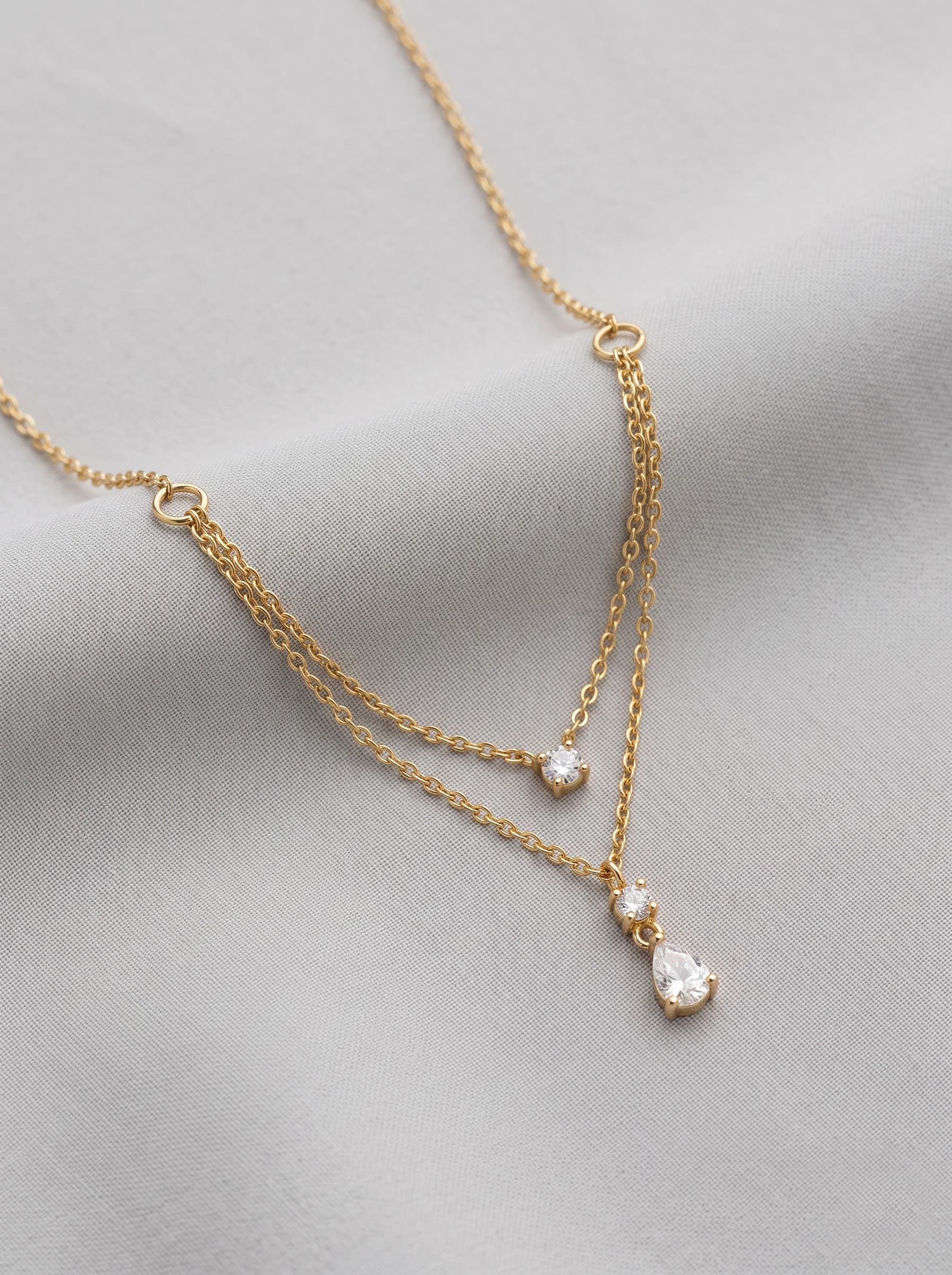 Layered gold chain necklace with dewdrop pendants