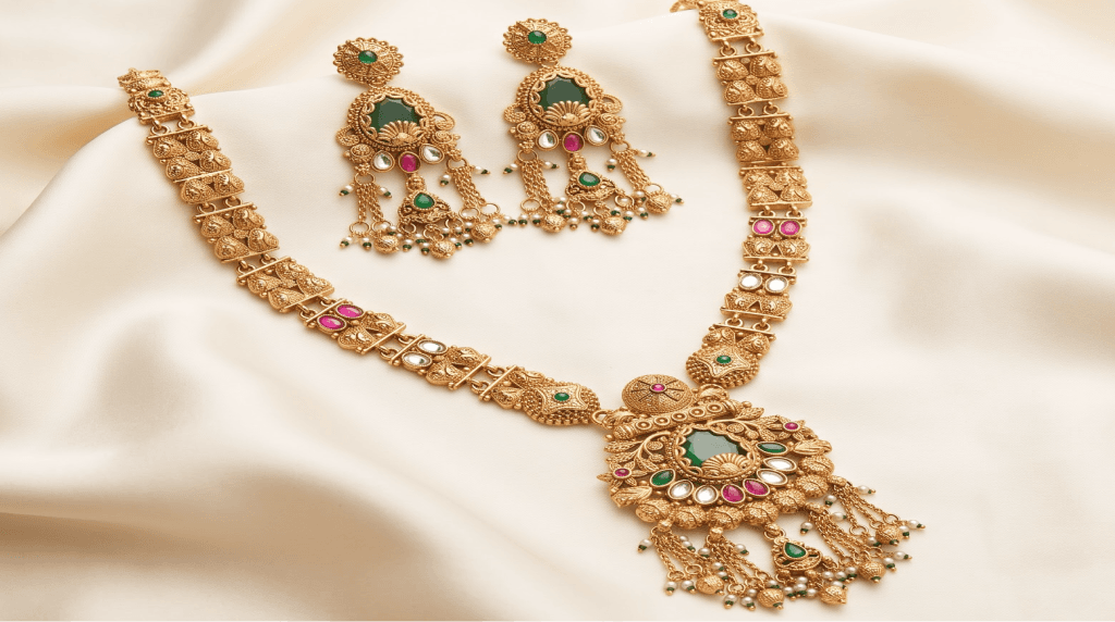 Gold temple haar necklace and earrings set with emerald stones