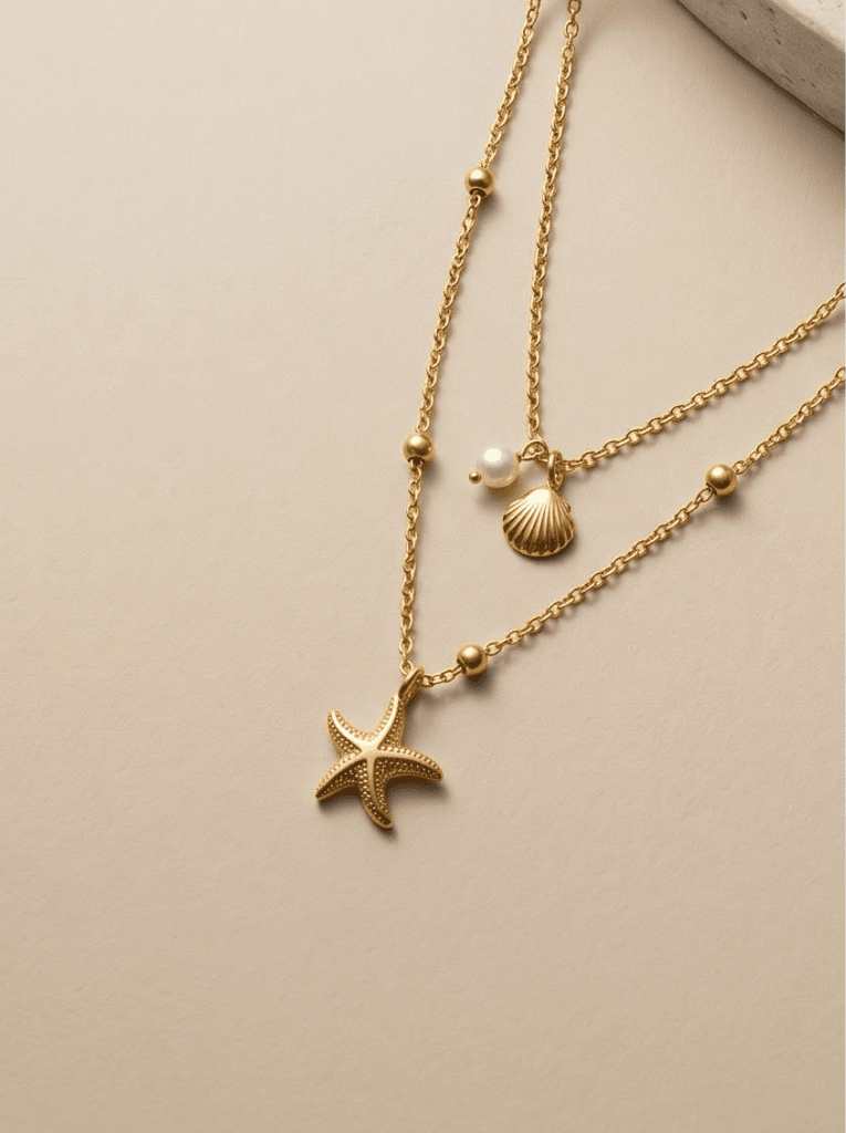 Layered gold starfish and pearl necklaces